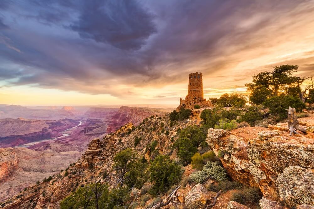 Grand Canyon summer lookout with bright canyon light and seasonal visitor atmosphere