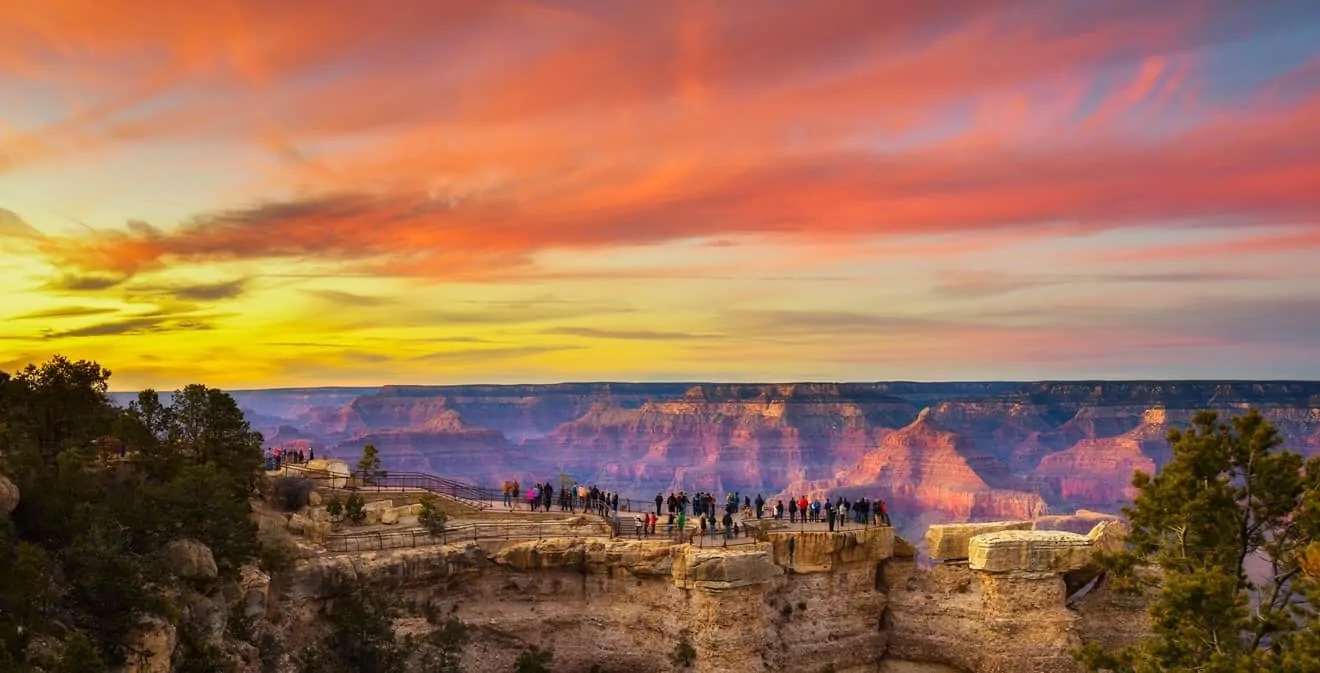 Mather Point Grand Canyon sunset with warm evening light over the canyon